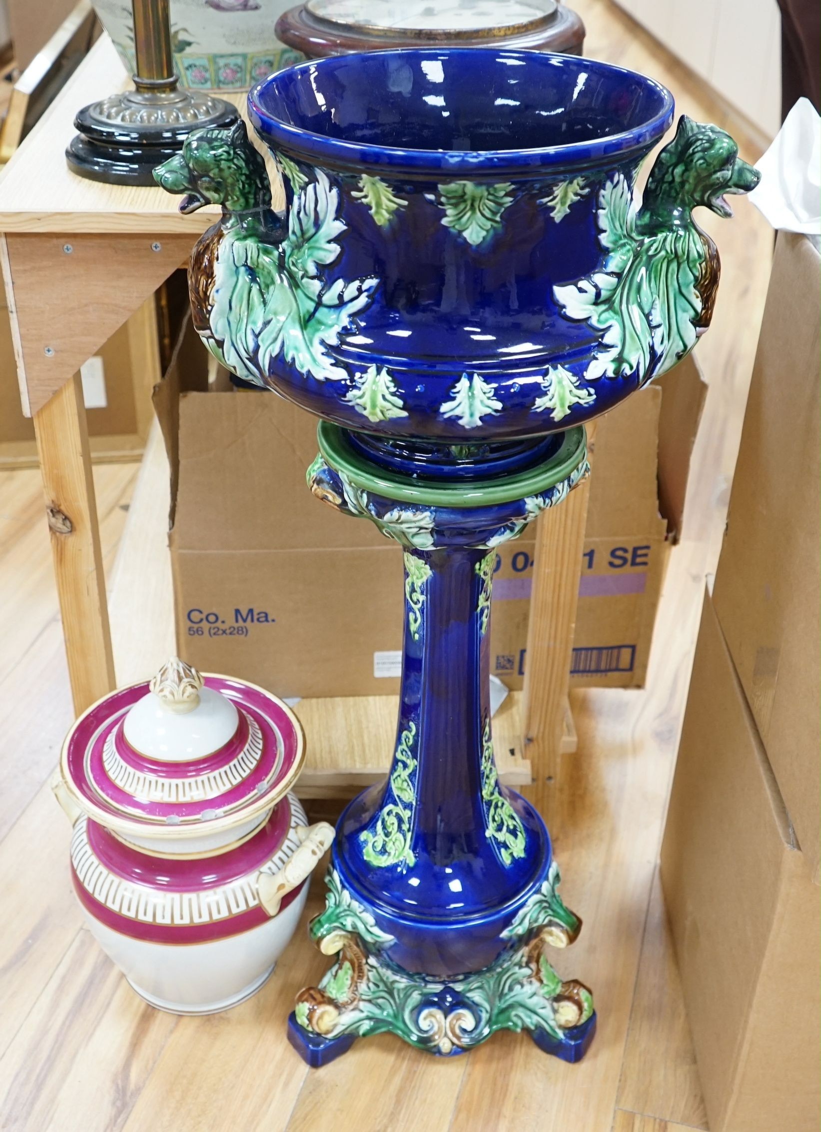 A 19th century majolica jardiniere on pedestal and a two handled jar and cover, jardiniere and stand 99cms high